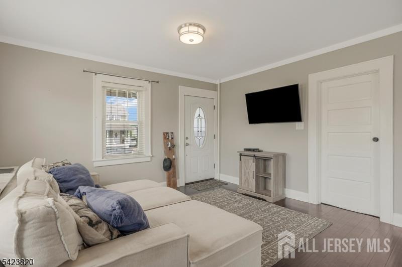 110 Parker Street Middlesex, NJ 08846 - Photo 9 of 25 a bedroom with a bed and a flat screen tv
