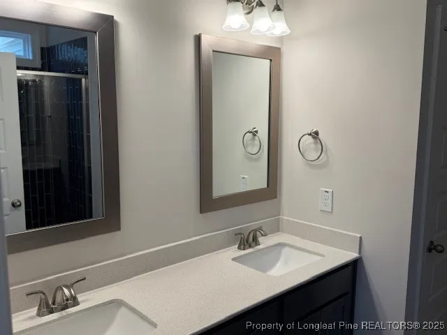 a bathroom with a sink vanity and a mirror