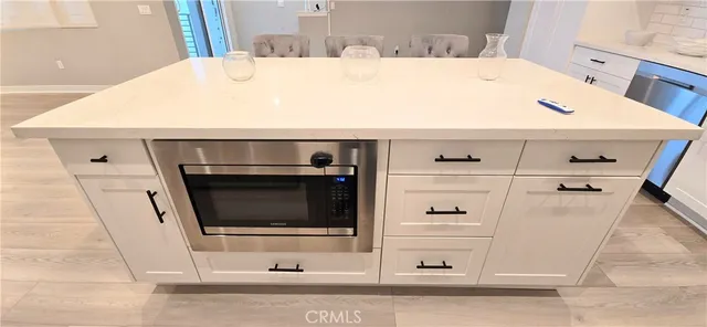 a view of an empty room and a window