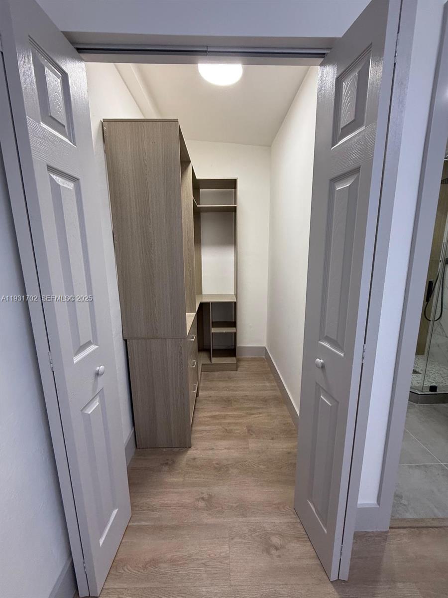 6790 Southwest 17th Street, Unit 6790 Miami, FL 33155 - Photo 5 of 7 a bathroom with a sink and a mirror