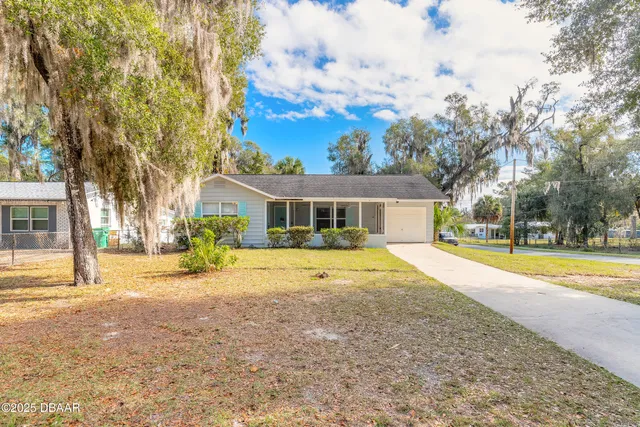 a house with swimming pool in front of it