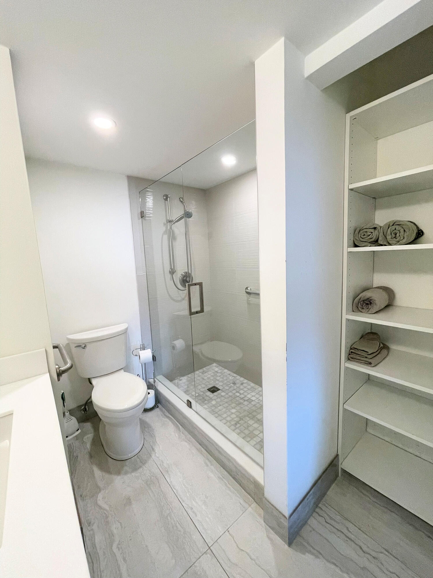 1030 Rexford B Boca Raton, FL 33434 - Photo 16 of 27 a bathroom with a sink a toilet and shower