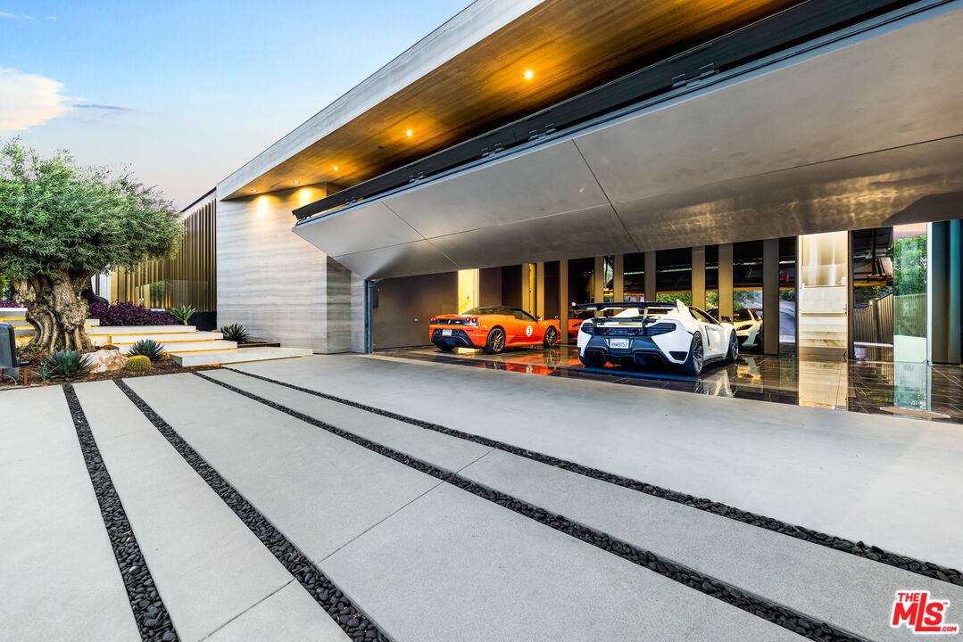 1108 Wallace Ridge Beverly Hills, CA 90210 - Photo 3 of 33 a outdoor space with lots of cars and parked