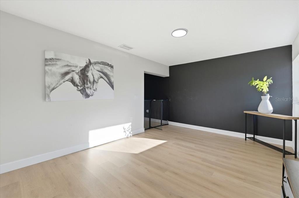 3454 Rambler Avenue St. Cloud, FL 34772 - Photo 15 of 24 a workspace with wooden floor