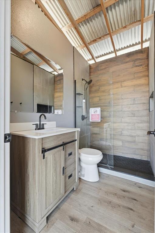 3454 Rambler Avenue St. Cloud, FL 34772 - Photo 18 of 24 a bathroom with a granite countertop sink toilet and shower