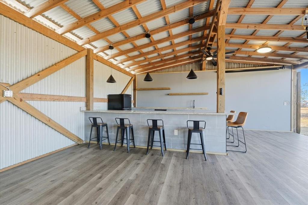 3454 Rambler Avenue St. Cloud, FL 34772 - Photo 21 of 24 a view of a chairs and table on the wooden floor