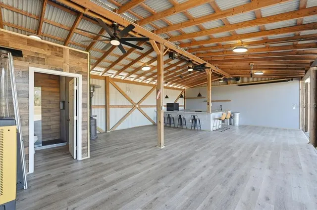a view of a room with wooden floor
