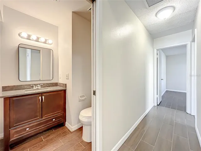 a bathroom with a sink double vanity mirror and a bathtub