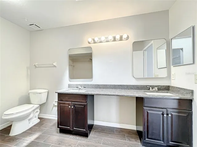 a bathroom with a bathtub a sink a toilet and a shower