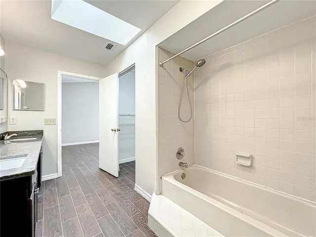 a bathroom with a bathtub and a shower
