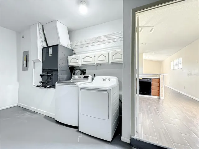 a utility room with dryer and washer