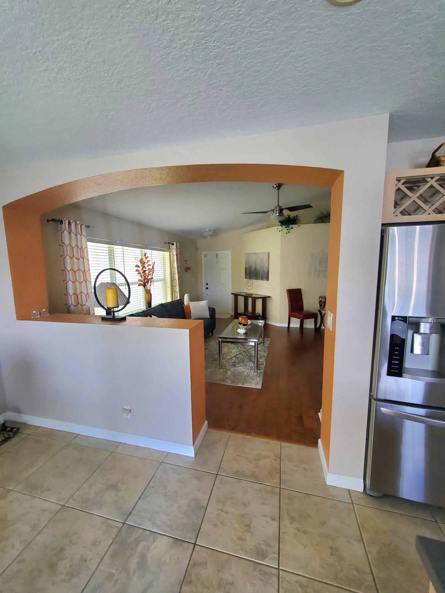1037 Big Torch Street Riviera Beach, FL 33407 - Photo 10 of 38 view from kitchen into living room
