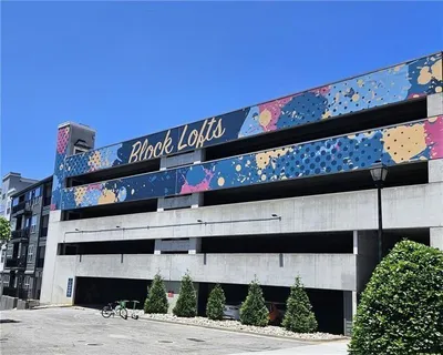 front view of a building with a garden
