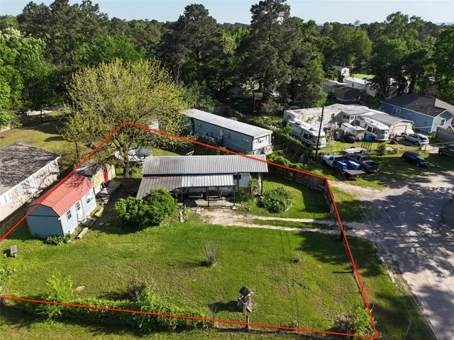 an aerial view of a house with yard swimming pool and outdoor seating