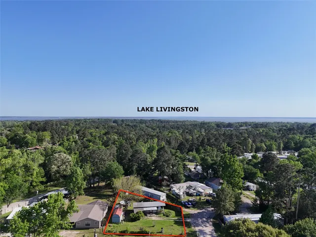 a view of a chair and table in the garden