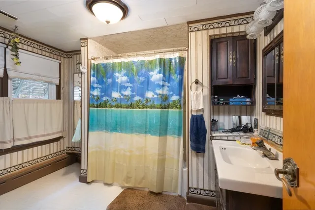a bathroom with a sink and a mirror
