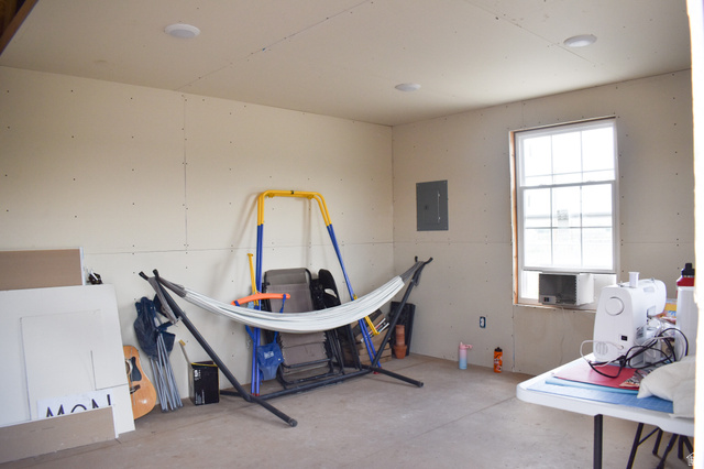 345 North Main Street Clawson, UT 84516 - Photo 16 of 17 Spacious interior room with an unpainted gypsum board finish, a single-pane window, and recessed ceiling lighting