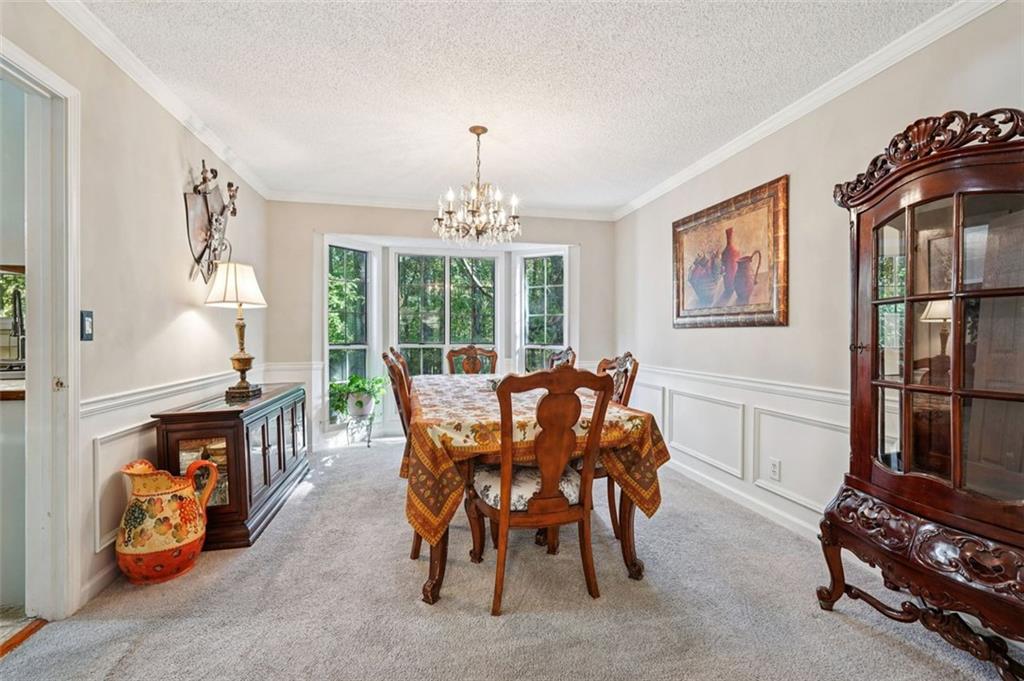 39 Hampton Way Carrollton, GA 30116 - Photo 11 of 57 a view of a dining room with furniture window and outside view
