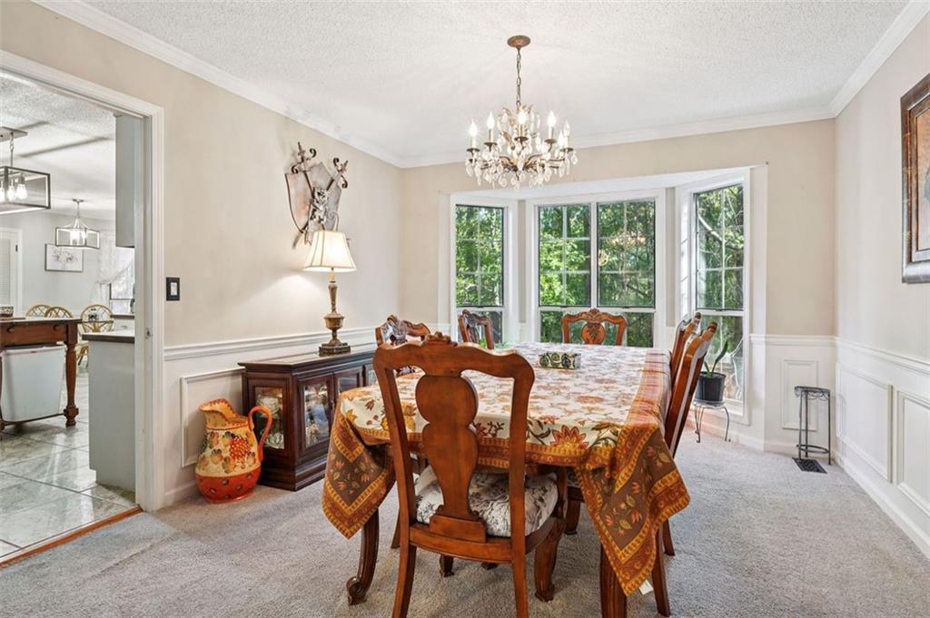 39 Hampton Way Carrollton, GA 30116 - Photo 12 of 57 a view of a dining room with furniture window and outside view