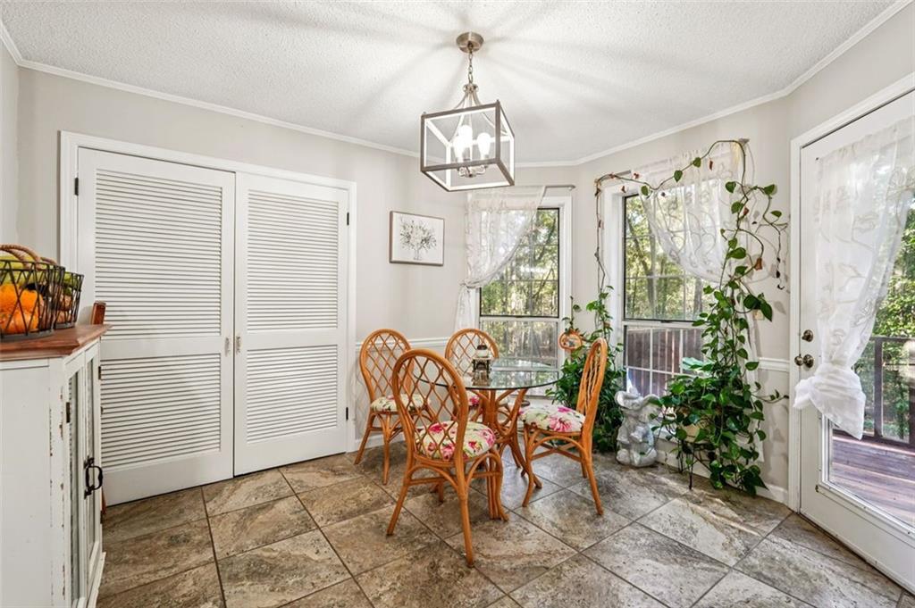 39 Hampton Way Carrollton, GA 30116 - Photo 22 of 57 a view of a dining room with furniture and chandelier