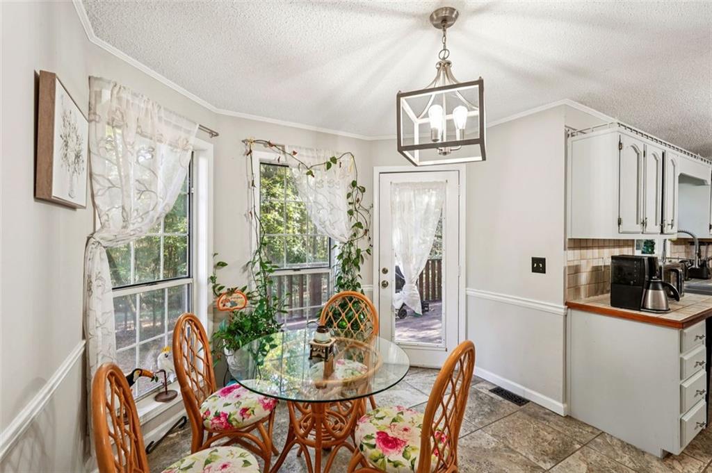 39 Hampton Way Carrollton, GA 30116 - Photo 23 of 57 a dining room with furniture and window