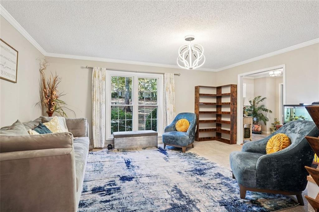 39 Hampton Way Carrollton, GA 30116 - Photo 24 of 57 a living room with furniture and a window