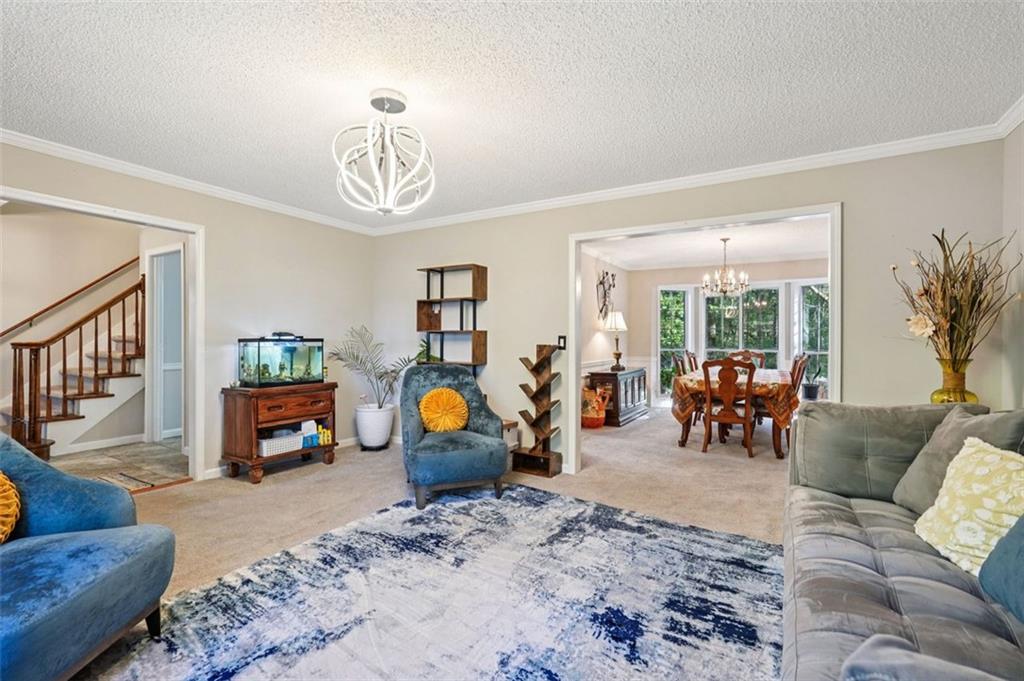39 Hampton Way Carrollton, GA 30116 - Photo 25 of 57 a view of living room filled with furniture and a couch