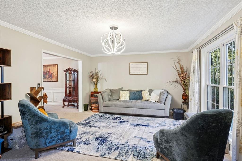 39 Hampton Way Carrollton, GA 30116 - Photo 27 of 57 a living room with furniture a couch and a window