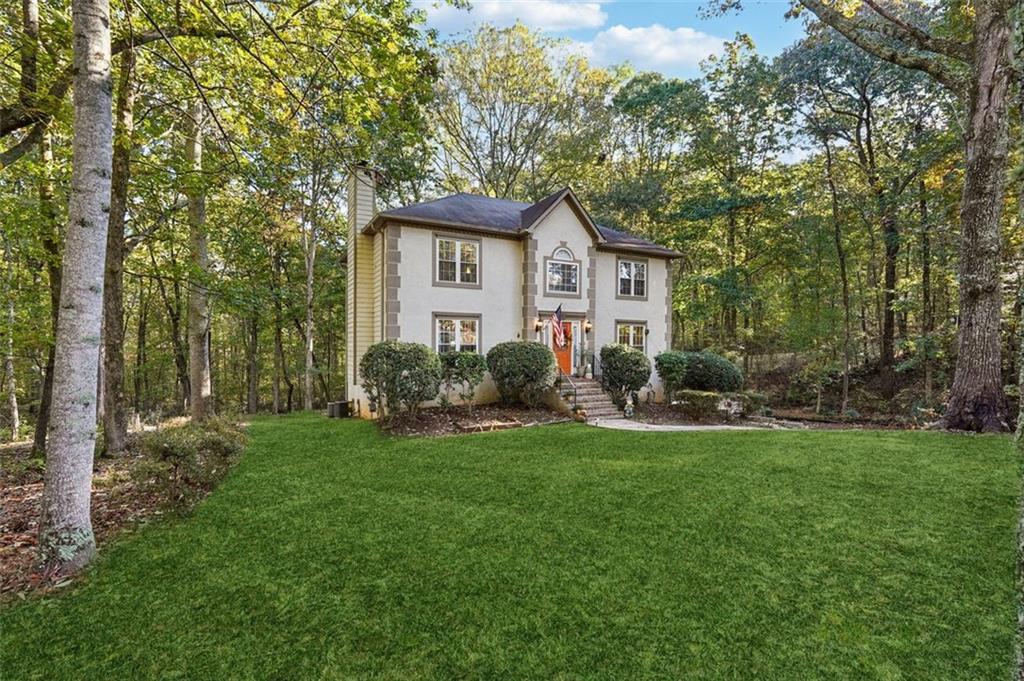 39 Hampton Way Carrollton, GA 30116 - Photo 3 of 57 a view of a house with backyard and a tree