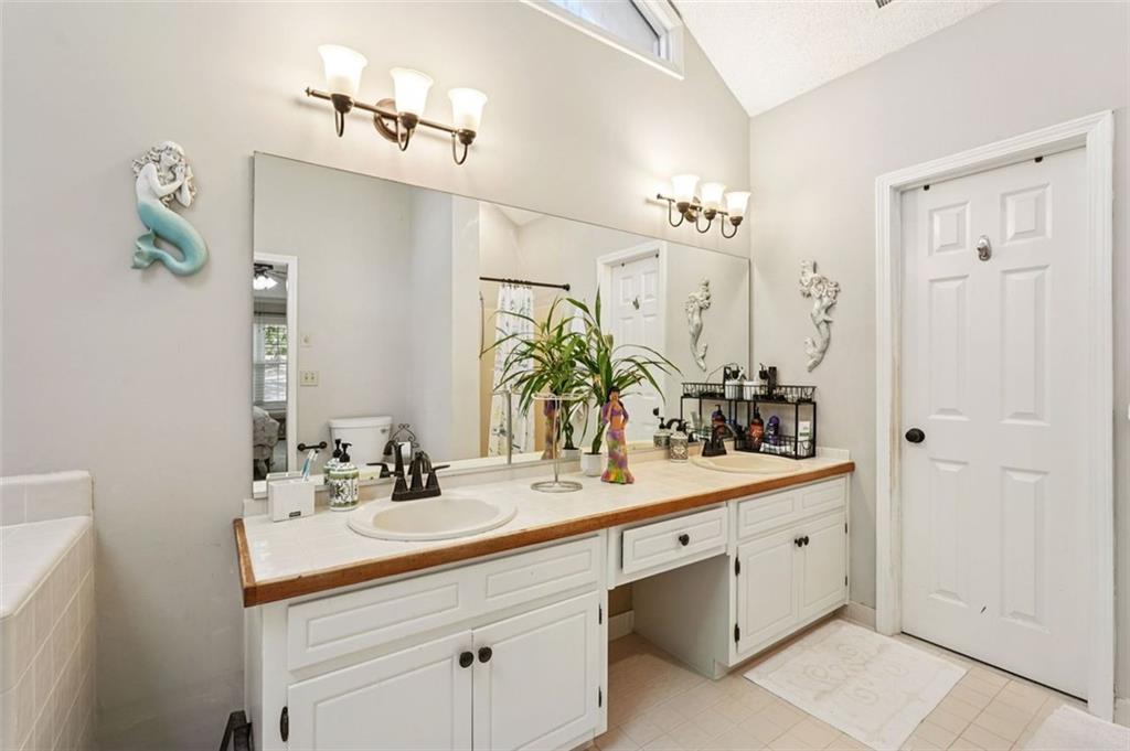 39 Hampton Way Carrollton, GA 30116 - Photo 33 of 57 a bathroom with a sink double vanity and a mirror