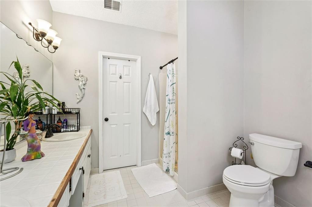 39 Hampton Way Carrollton, GA 30116 - Photo 36 of 57 a bathroom with a sink a toilet and shower