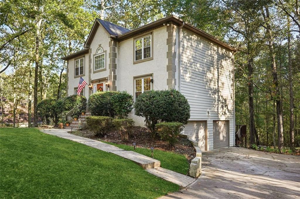 39 Hampton Way Carrollton, GA 30116 - Photo 4 of 57 a front view of a house with a yard and trees