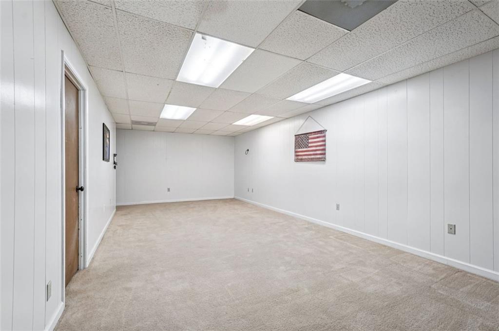 39 Hampton Way Carrollton, GA 30116 - Photo 48 of 57 an empty room with windows