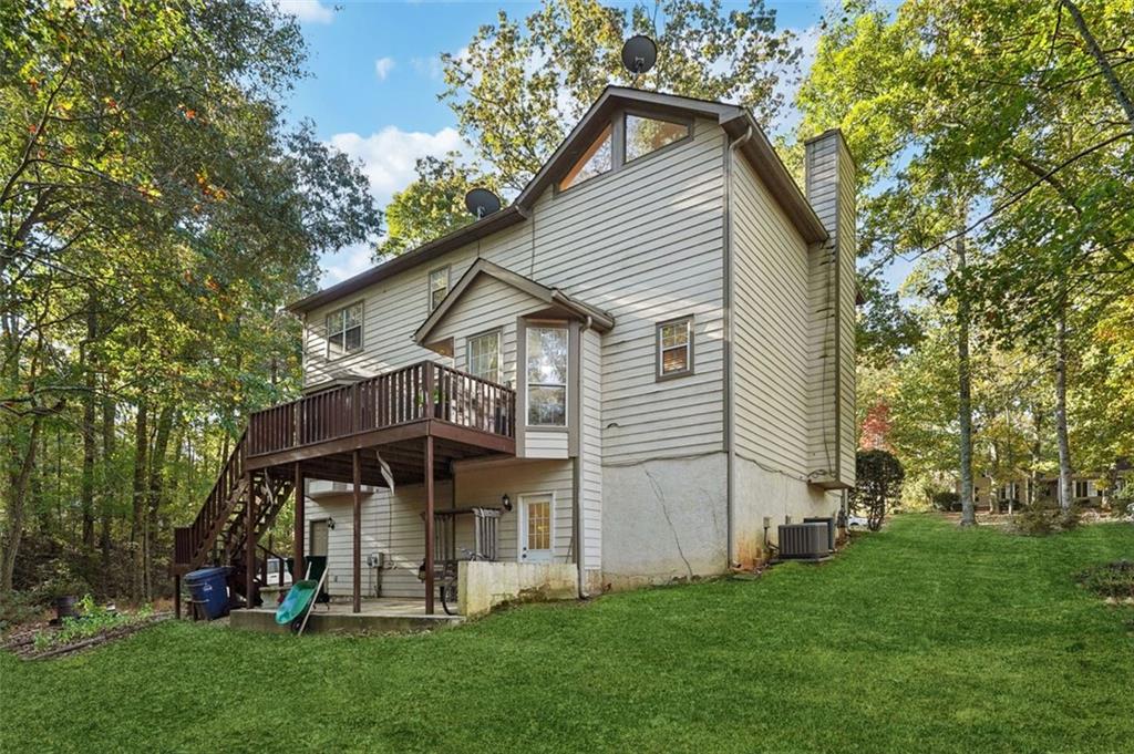 39 Hampton Way Carrollton, GA 30116 - Photo 51 of 57 a view of a house with a yard and sitting area