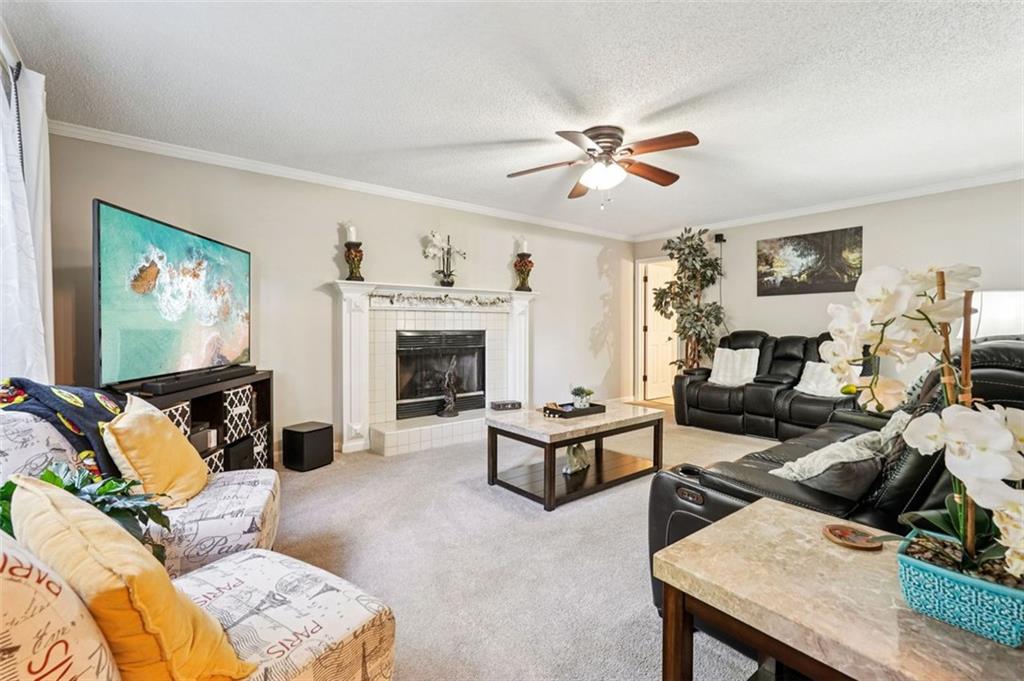 39 Hampton Way Carrollton, GA 30116 - Photo 7 of 57 a living room with furniture and a fireplace