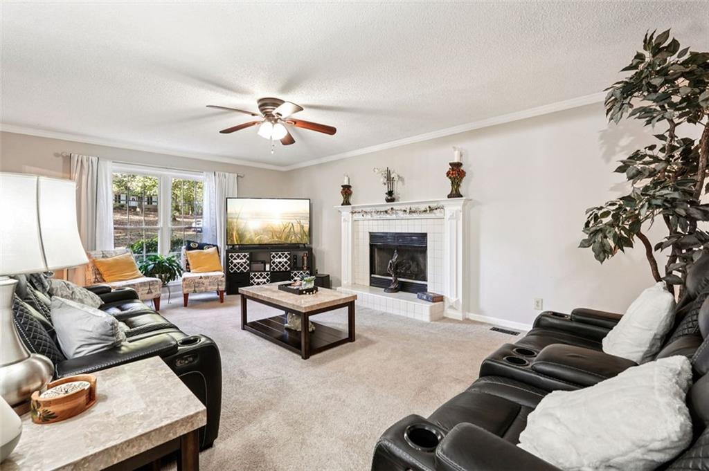 39 Hampton Way Carrollton, GA 30116 - Photo 10 of 57 a living room with furniture and a fireplace