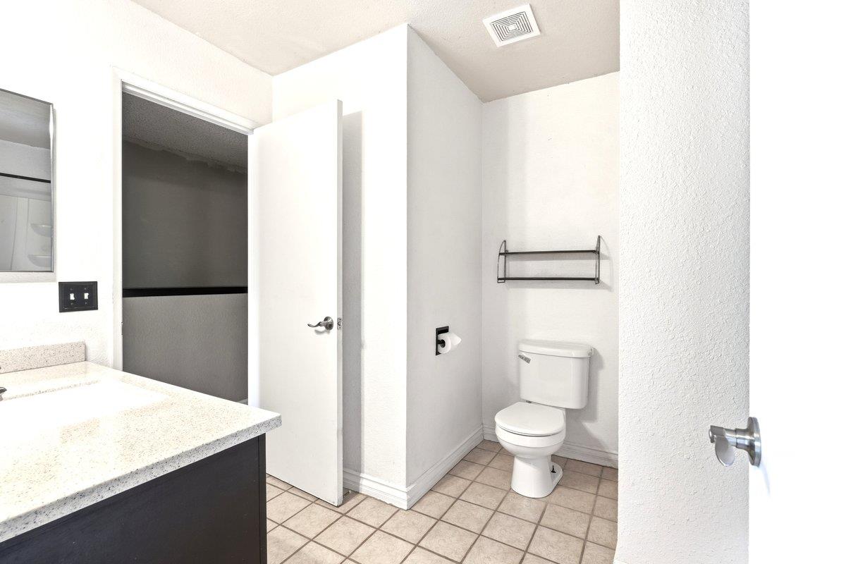 4085 Dale Road, Unit B Modesto, CA 95356 - Photo 17 of 27 a bathroom with a sink a toilet and a mirror