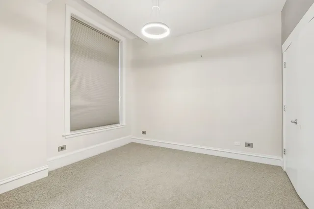 an empty room with a mirror