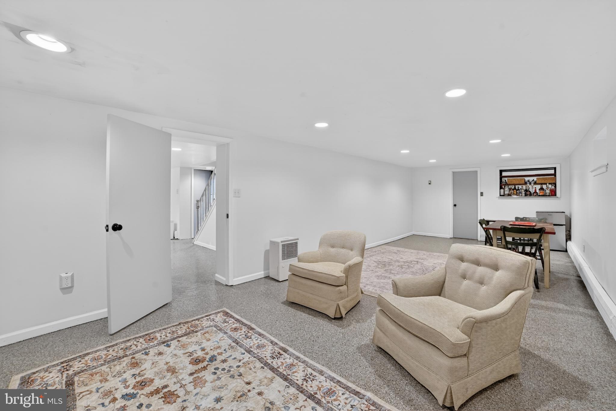 305 Irish Road Berwyn, PA 19312 - Photo 30 of 34 a living room with furniture and a rug