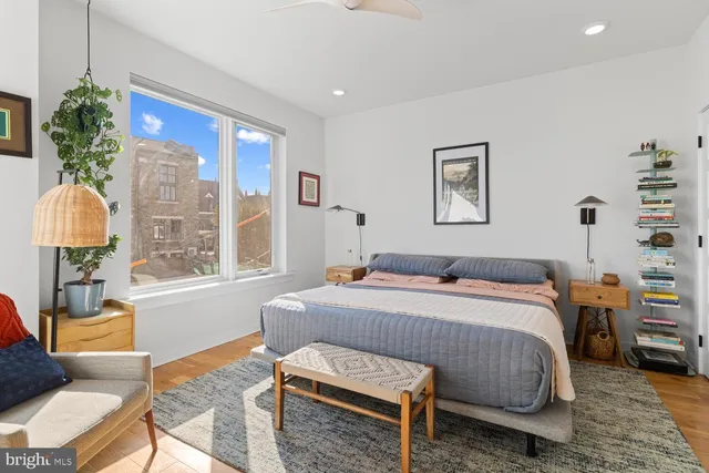 a bedroom with a bed and a couch