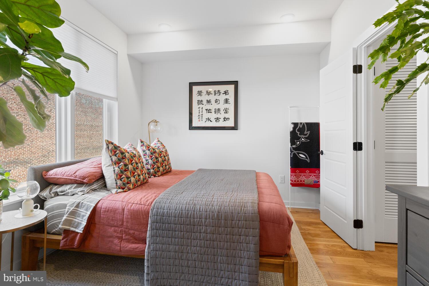 23 East Durham Street, Unit C2 Philadelphia, PA 19119 - Photo 21 of 40 a bedroom with a bed and a potted plant