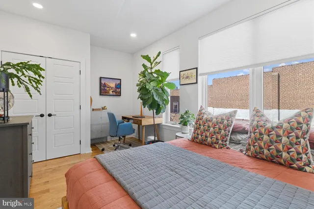 a bedroom with bed and a window