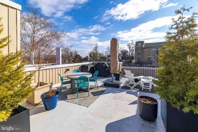 a view of a backyard with sitting area