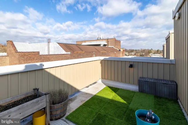 a view of a backyard with plants and a garden