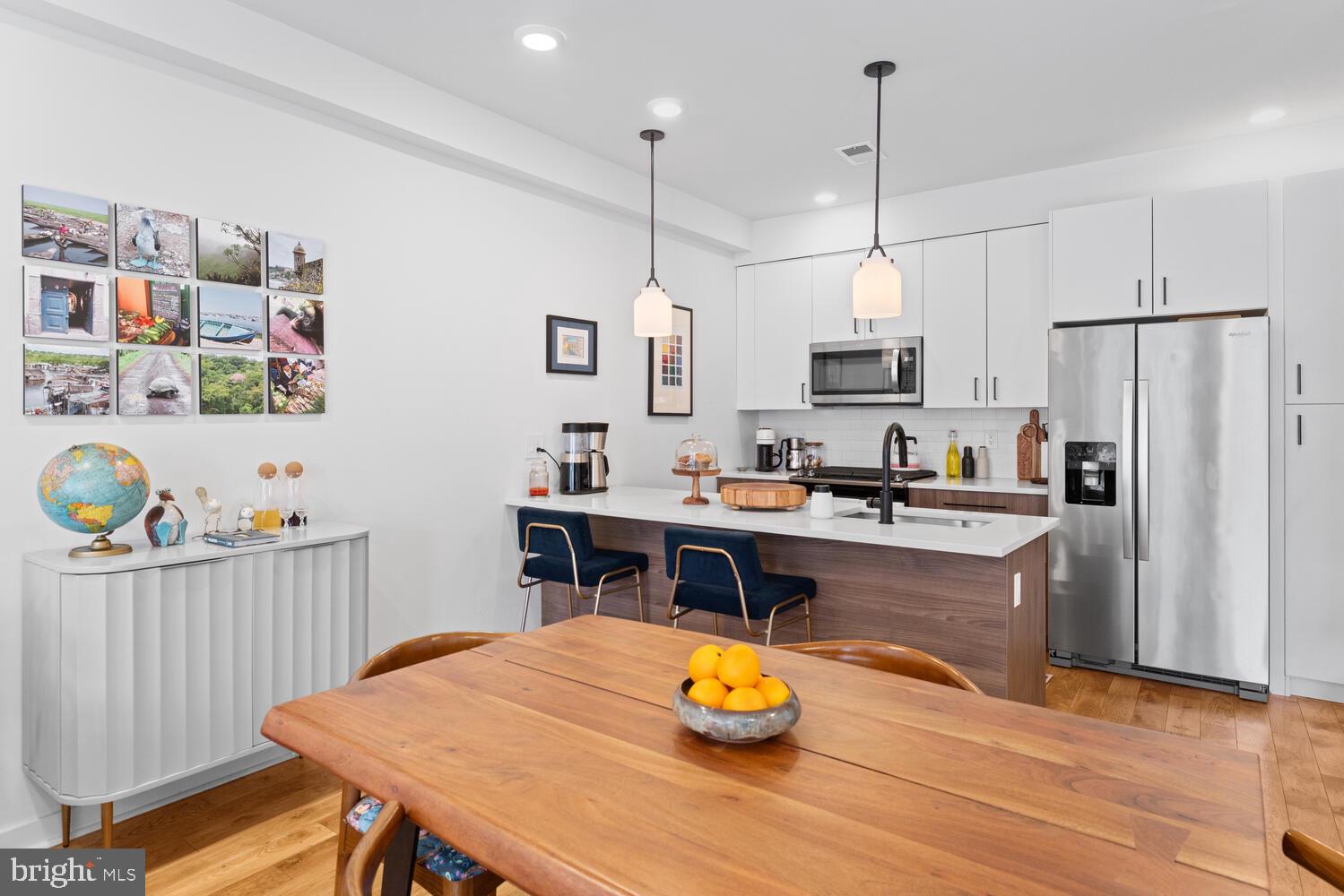 23 East Durham Street, Unit C2 Philadelphia, PA 19119 - Photo 4 of 40 a kitchen with stainless steel appliances granite countertop a sink dishwasher and a refrigerator with wooden floor