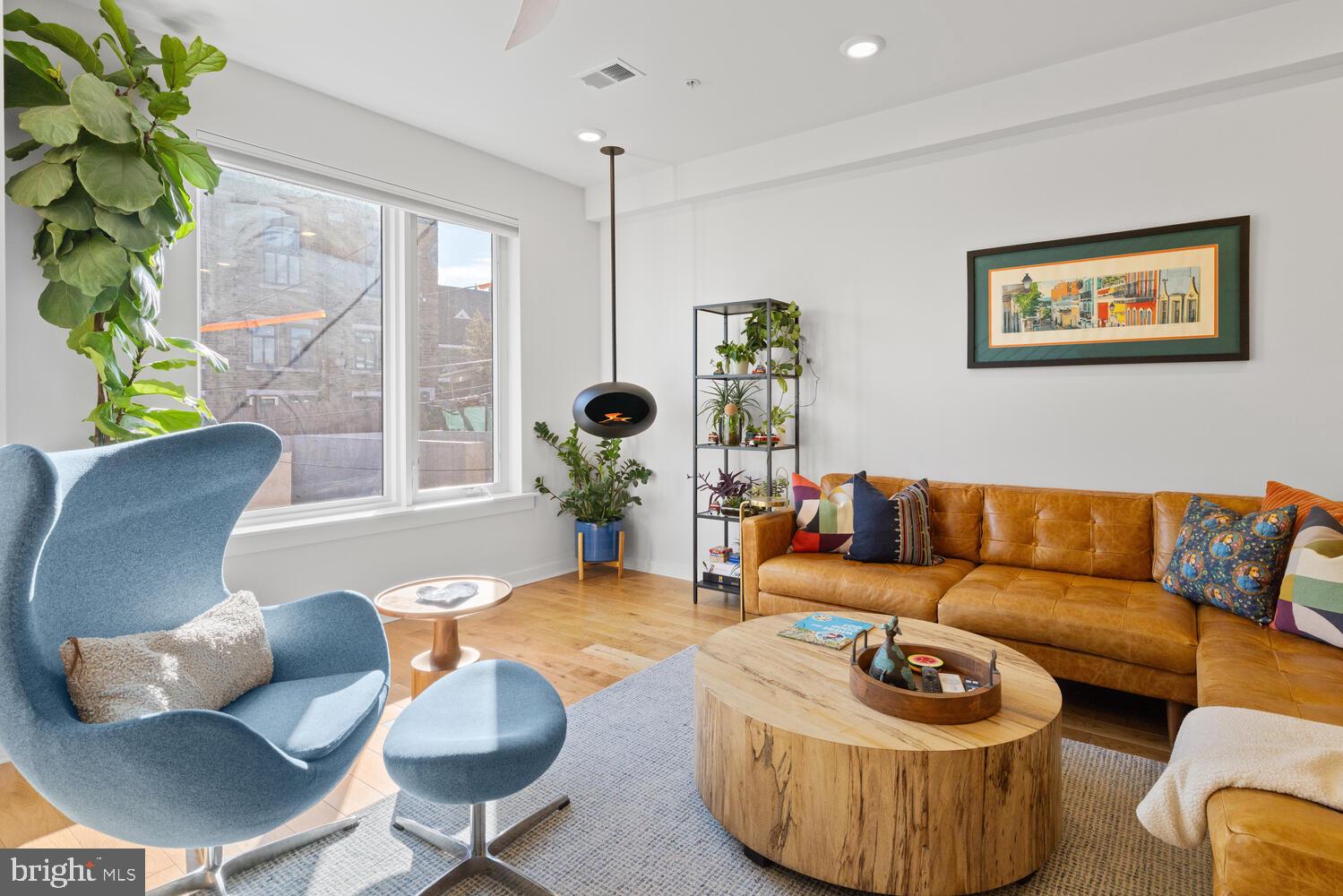 23 East Durham Street, Unit C2 Philadelphia, PA 19119 - Photo 10 of 40 a living room with furniture and a potted plant
