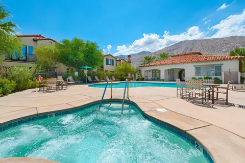 a swimming pool with outdoor seating and yard