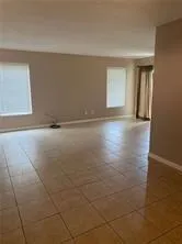 a kitchen with white cabinets and a stove top oven