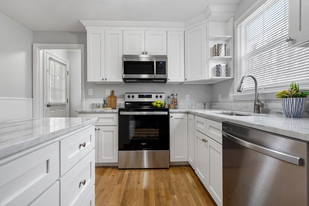 63 Pommogussett Road Rutland, MA 01543 - Photo 6 of 38 a kitchen with white cabinets stainless steel appliances and a sink