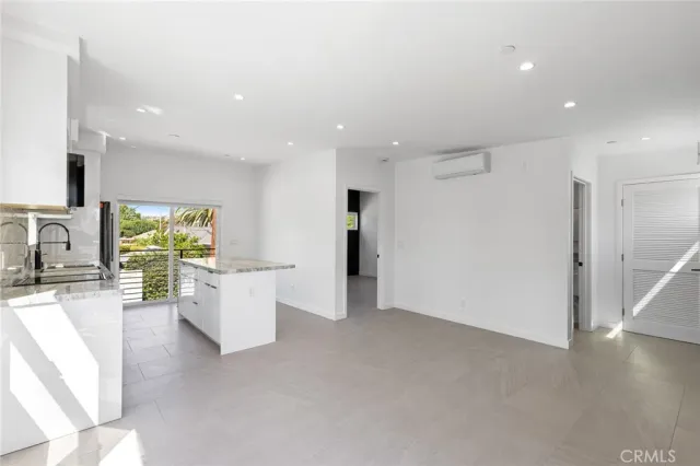 a view of living room with furniture and a flat screen tv